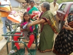 Tricycle donated to handicapped children